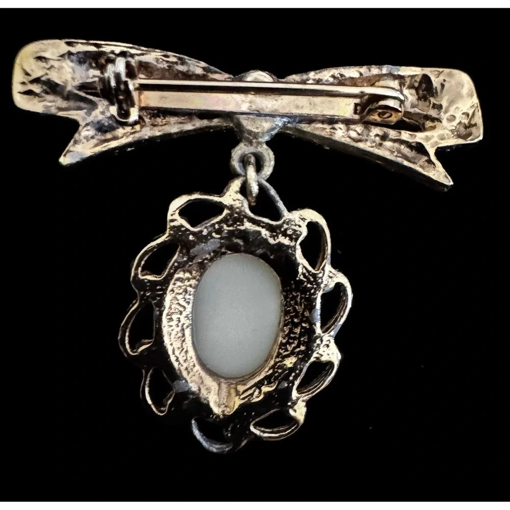 Vintage Gold Tone Bow Brooch White Oval Cabochon Dangle Scalloped Filigree Pin